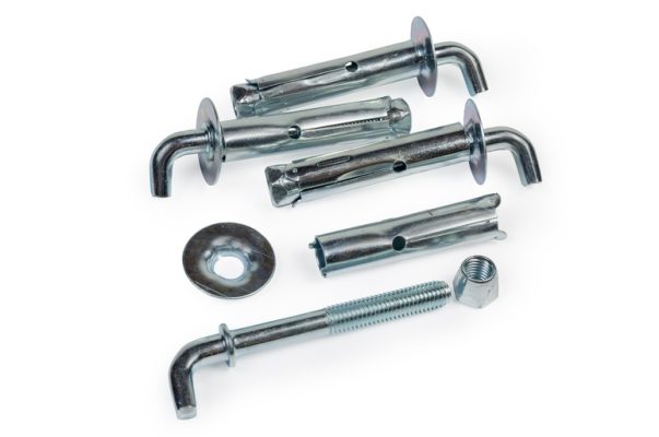 Several metal components, including wall anchors, hooks, and fasteners against a plain white background.